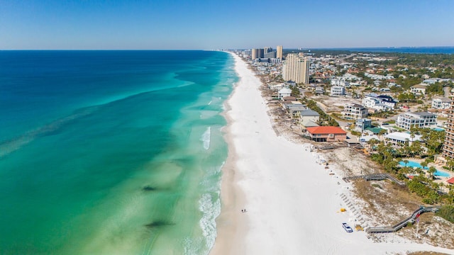 aerial view featuring a city view, a water view, and a beach view