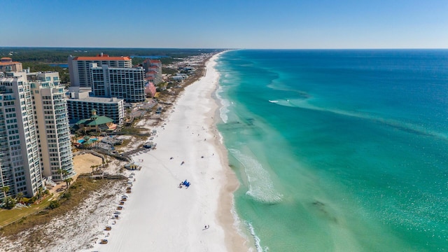 birds eye view of property with a water view, a view of city, and a view of the beach