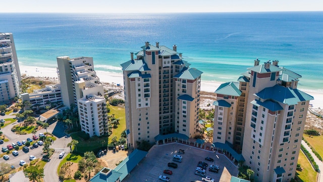 aerial view featuring a view of the beach and a water view