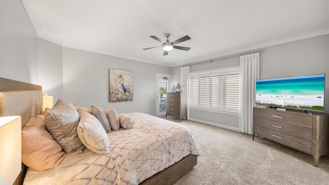 bedroom with baseboards, crown molding, and light colored carpet