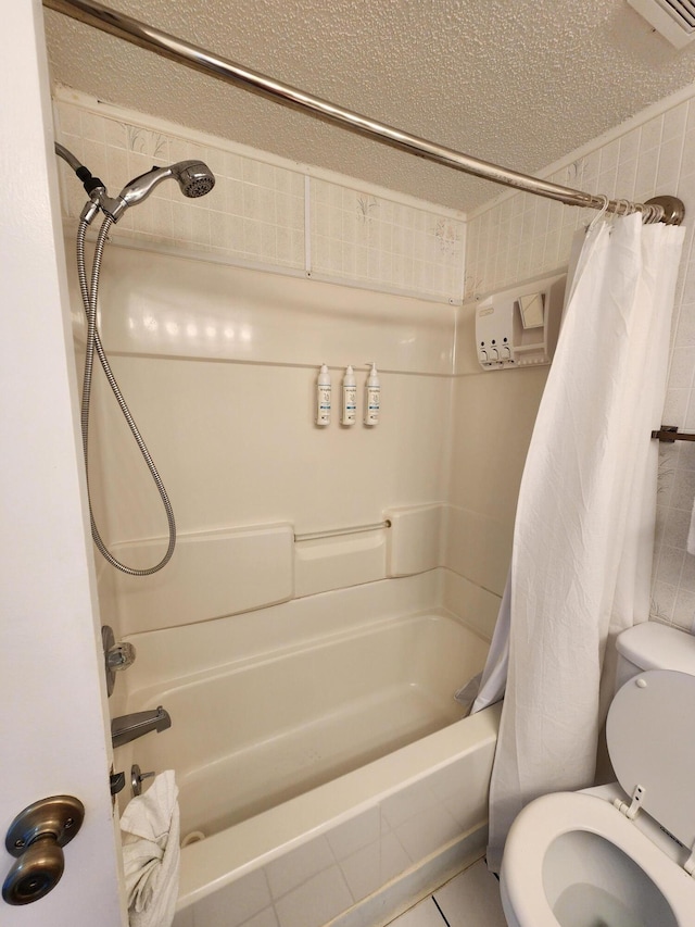 full bath with a textured ceiling, visible vents, shower / bath combo, and toilet