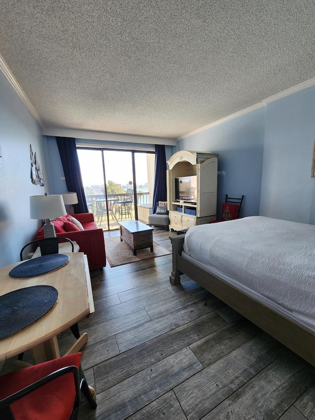 bedroom featuring a textured ceiling, ornamental molding, wood-type flooring, and access to exterior