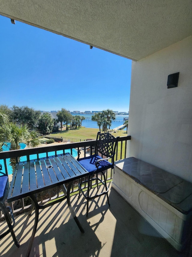 balcony featuring a water view