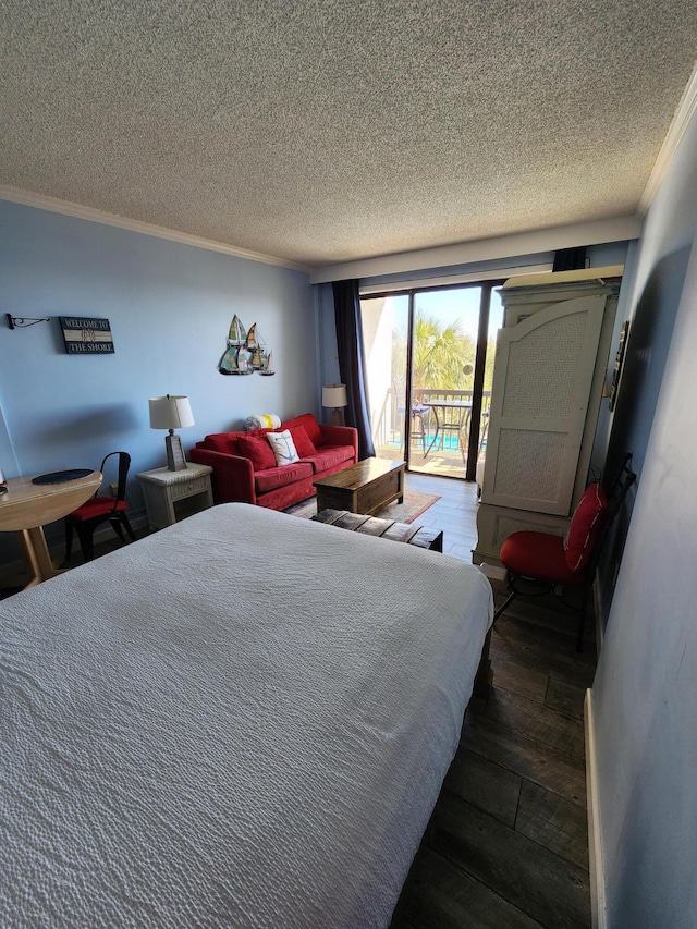 bedroom featuring access to exterior, crown molding, a textured ceiling, and hardwood / wood-style flooring