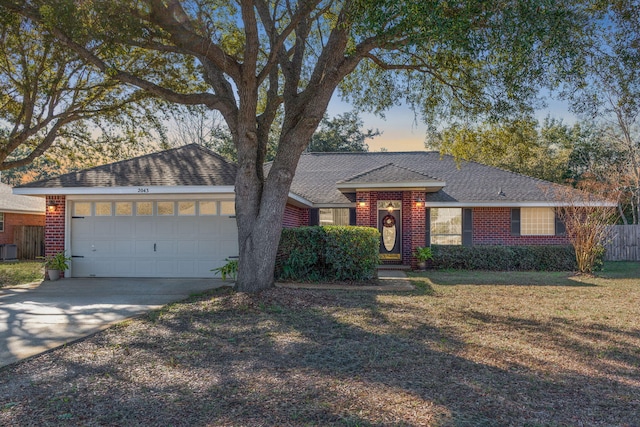 ranch-style house featuring a garage, concrete driveway, brick siding, and a shingled roof