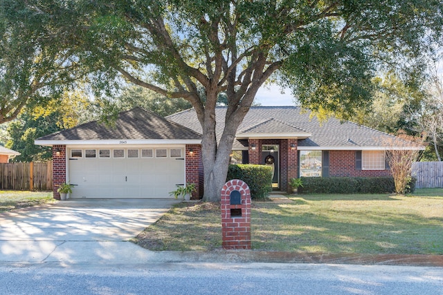 ranch-style house with an attached garage, a front yard, fence, and brick siding