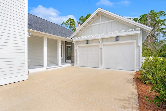 garage featuring concrete driveway