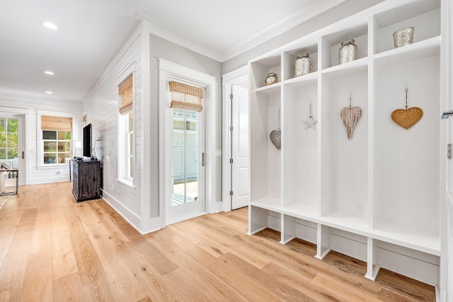 mudroom featuring light wood-style floors, ornamental molding, and recessed lighting