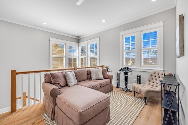 living area with recessed lighting, baseboards, and wood finished floors