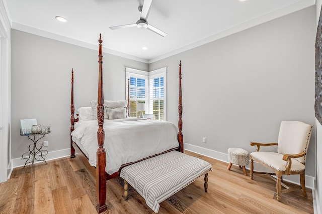 bedroom featuring light wood-style floors, recessed lighting, baseboards, and ornamental molding