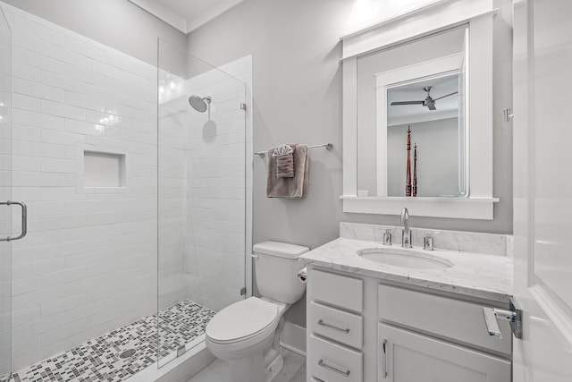 full bath with toilet, a stall shower, and vanity