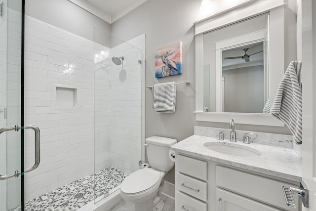 bathroom featuring a stall shower, vanity, and toilet