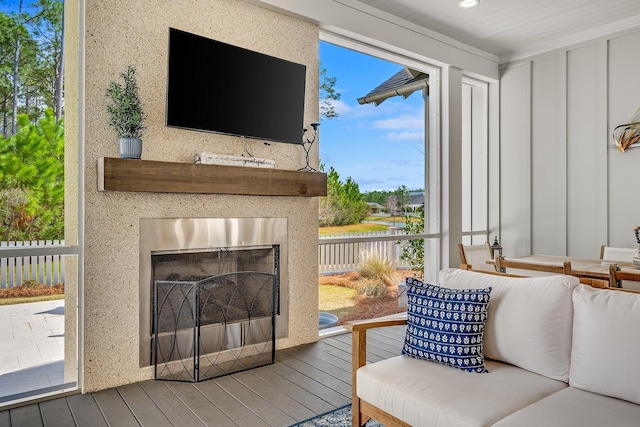 living area featuring a fireplace and wood finished floors