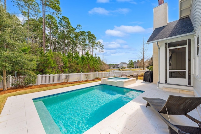 view of swimming pool featuring an in ground hot tub, a patio area, a fenced backyard, and a fenced in pool