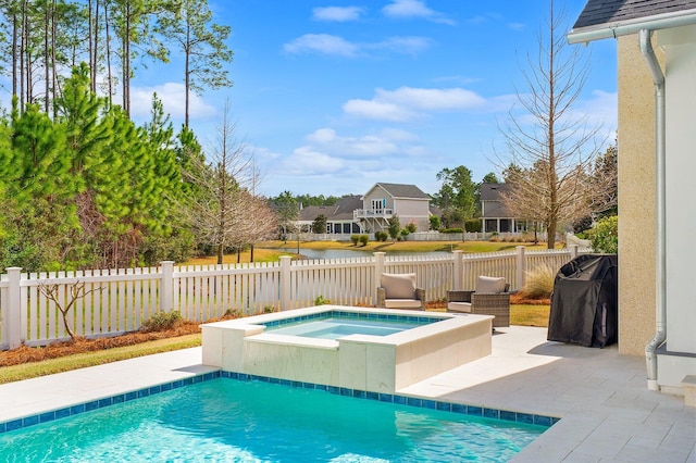 view of swimming pool featuring a fenced in pool, area for grilling, a patio, a fenced backyard, and an in ground hot tub