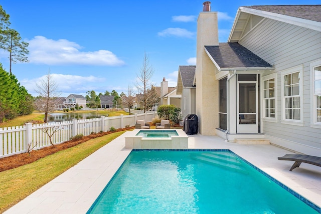 view of swimming pool with a patio, a fenced backyard, an in ground hot tub, a water view, and a fenced in pool