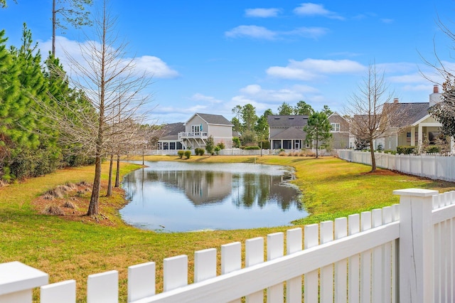 property view of water featuring fence