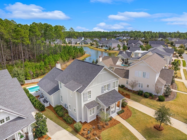 bird's eye view with a water view and a residential view