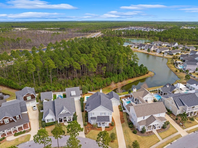 bird's eye view featuring a water view, a residential view, and a view of trees