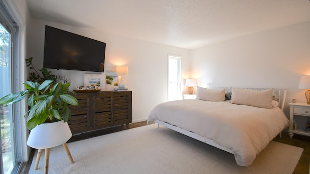 bedroom featuring multiple windows