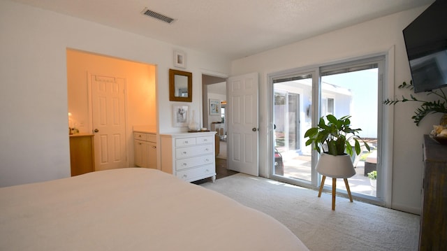 bedroom featuring access to outside, multiple windows, visible vents, and light colored carpet