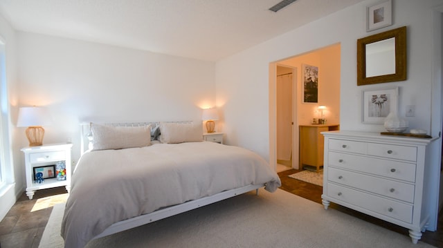 bedroom featuring visible vents