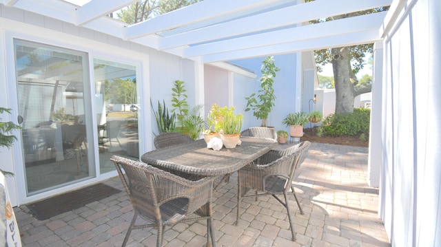 view of patio / terrace with outdoor dining space and a pergola