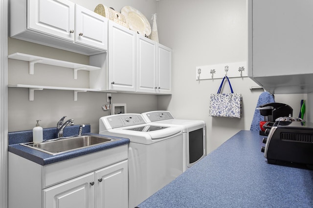 laundry room featuring a sink, cabinet space, and washer and clothes dryer