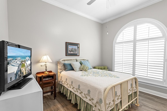 bedroom with ceiling fan, baseboards, wood finished floors, and ornamental molding