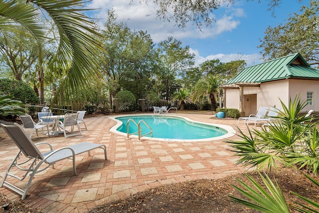 view of pool featuring a fenced in pool, fence, and a patio area