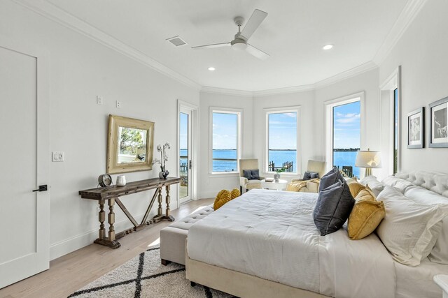 bedroom with ornamental molding, baseboards, and light wood finished floors