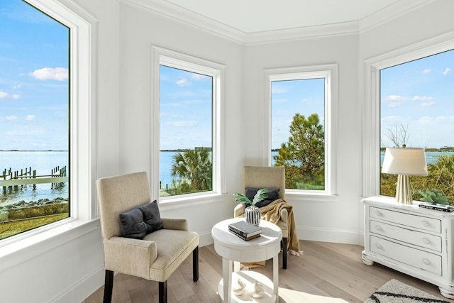 sunroom / solarium with a water view