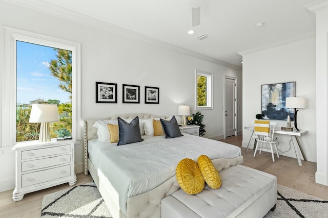 bedroom with baseboards, visible vents, ornamental molding, wood finished floors, and recessed lighting