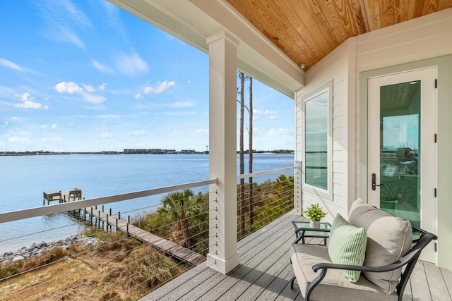 exterior space featuring wood ceiling and a water view