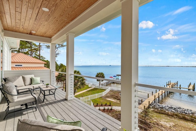 wooden deck with a water view