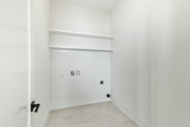 laundry room with baseboards, laundry area, washer hookup, and hookup for an electric dryer