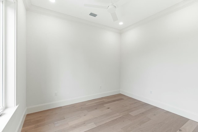 unfurnished room featuring light wood-style flooring, ornamental molding, ceiling fan, and baseboards