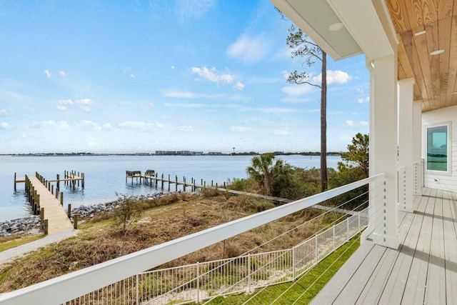 exterior space with a water view and a balcony