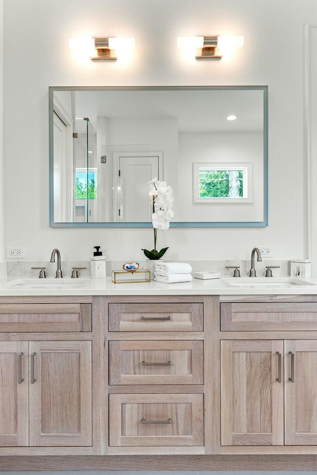 full bath featuring double vanity and a sink