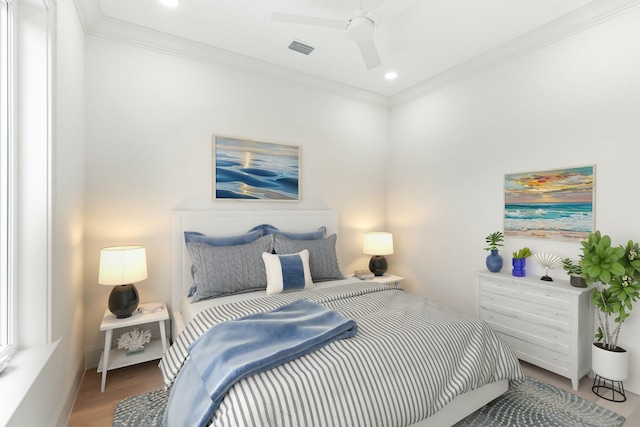 bedroom featuring ornamental molding, recessed lighting, visible vents, and wood finished floors