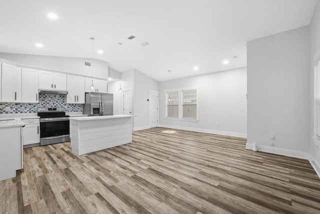 kitchen with stainless steel appliances, white cabinets, hanging light fixtures, light countertops, and a center island