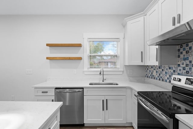 kitchen featuring open shelves, appliances with stainless steel finishes, white cabinets, a sink, and under cabinet range hood