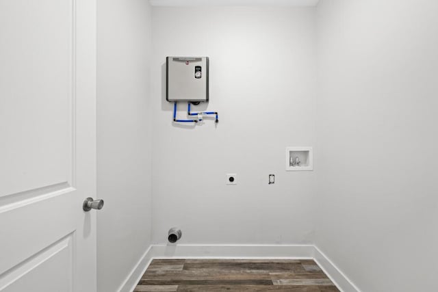 clothes washing area with laundry area, dark wood-style flooring, hookup for a washing machine, tankless water heater, and electric dryer hookup