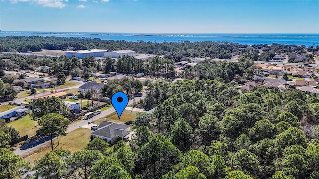 birds eye view of property featuring a water view and a residential view