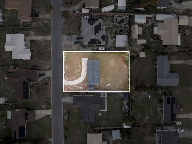 birds eye view of property with a residential view