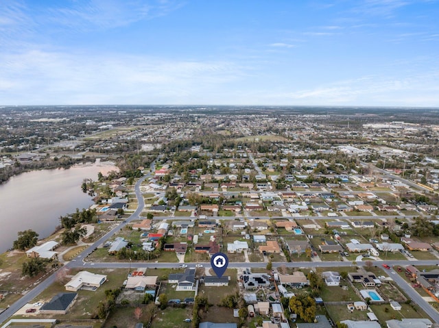 drone / aerial view with a water view and a residential view