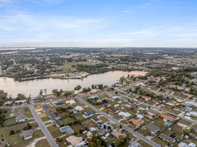 bird's eye view featuring a residential view and a water view