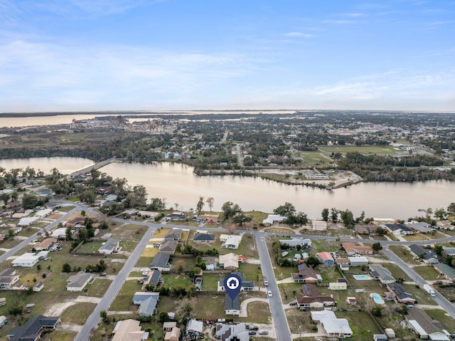 bird's eye view with a water view and a residential view