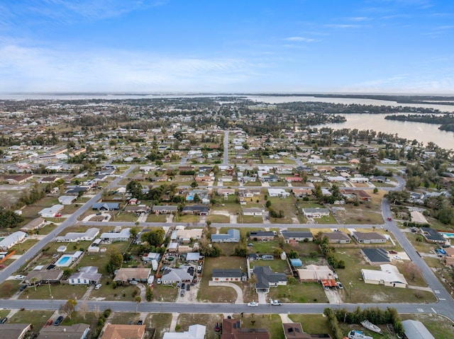 bird's eye view with a water view and a residential view