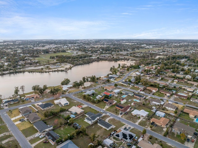 drone / aerial view with a water view and a residential view